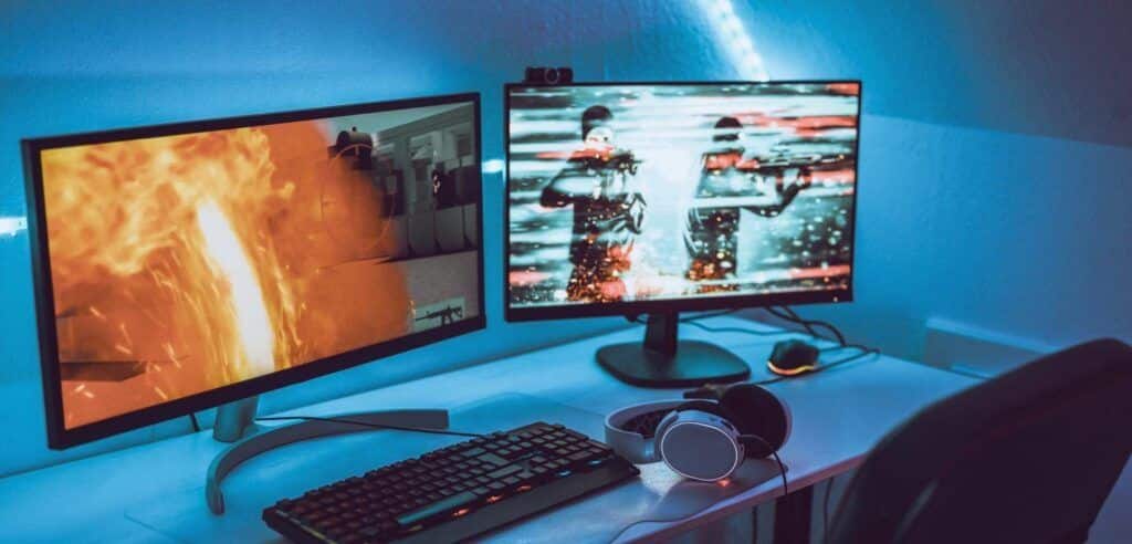 Game Bugs: Empty Gaming Setup with Headset, Dual Screens, and Esports Live Streaming